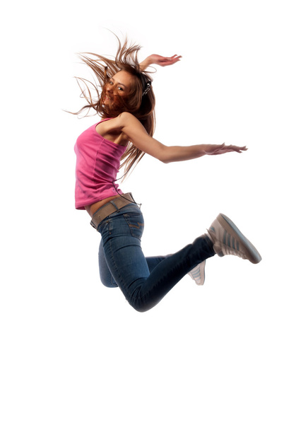 Girl in headphones jumps - Foto, Imagen
