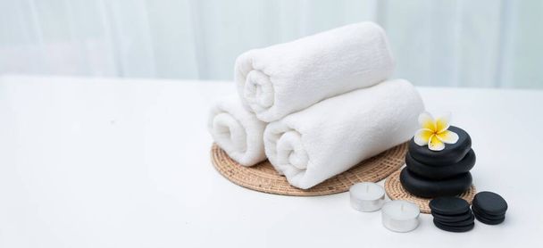 Spa accessory composition set in day spa hotel , beauty wellness center . Spa product are placed in luxury spa resort room , ready for massage therapy from professional service . - Photo, Image