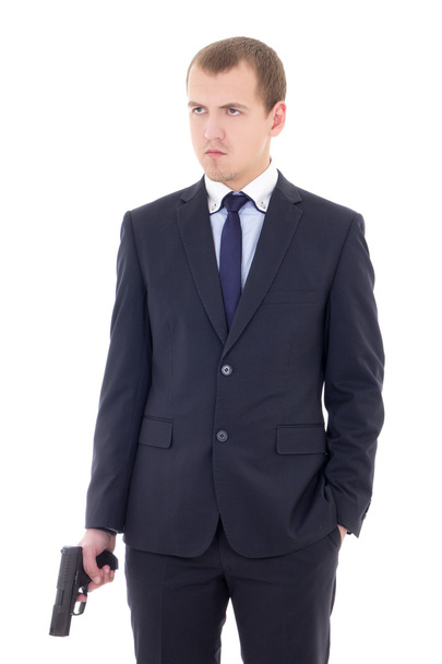 jeune homme en costume d'affaires avec l'arme de poing isolé sur blanc - Photo, image