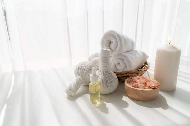 Spa accessory composition set in day spa hotel , beauty wellness center . Spa product are placed in luxury spa resort room , ready for massage therapy from professional service . - Foto, immagini