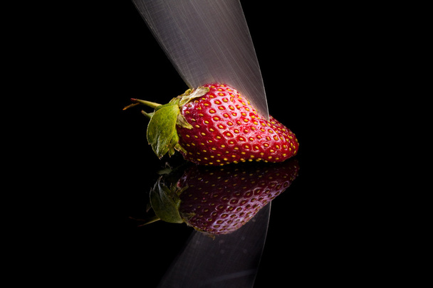Cook cut strawberries in a glass desk. - Fotoğraf, Görsel