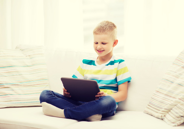 smiling boy with tablet computer at home - Foto, Imagem