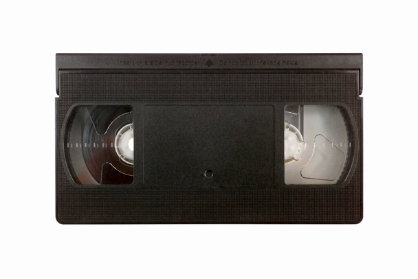 白を背景に分離された90年代のヴィンテージVHSテープのスタジオショット. - 写真・画像