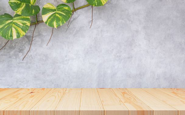 Empty wooden table with creeper plant growing on loft cement Wall Background, suitable for Product Display Presentation - Photo, Image