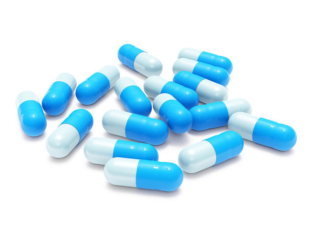 Many blue-gray pills on white - Fotó, kép