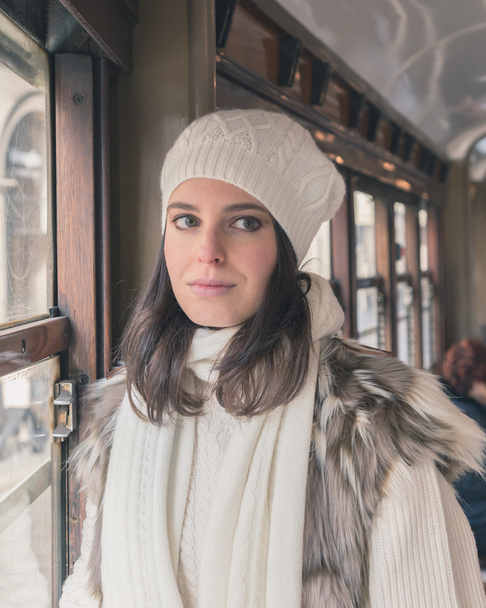 Beautiful young woman posing on a tram - Fotografie, Obrázek