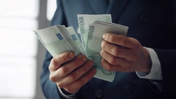 Finansist hands holding european currency denomination of hundred close up. Unknown business man counting euro banknotes. Successful manager having pack of cash. Salary investment profit concept. - 映像、動画