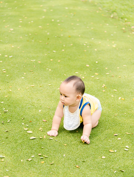 Baby boy in action at the park - Фото, изображение