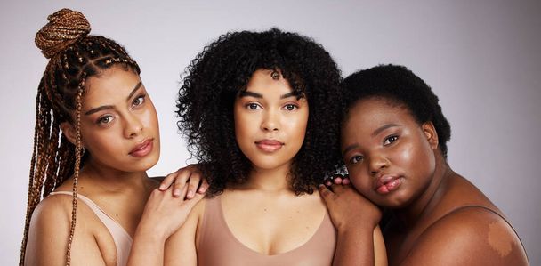 Portrait, skincare and diversity with woman friends in studio on a gray background together for beauty. Face, makeup and natural with a female model group posing to promote support or inclusion. - Foto, Imagen