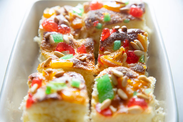 Coca de sant joan. Traditional San Juan cake to celebrate the arrival of summer in Spain made with brioche bread, candied fruit and nuts. - Photo, Image