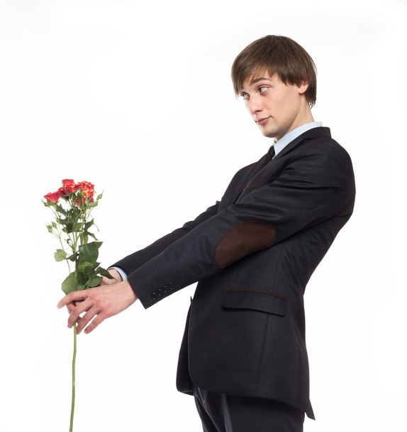 young man with flowers - Фото, зображення