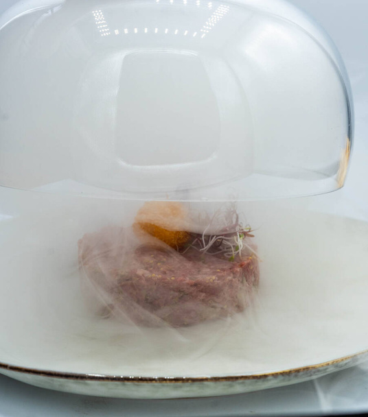 An impressive high-quality smoked beef tartare - Zdjęcie, obraz