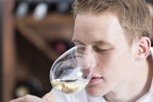man smelling a glass of white win - Photo, Image