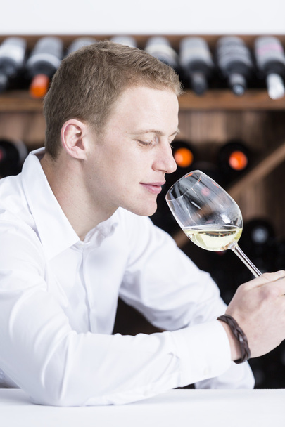 man smelling a white wineglass - Photo, Image