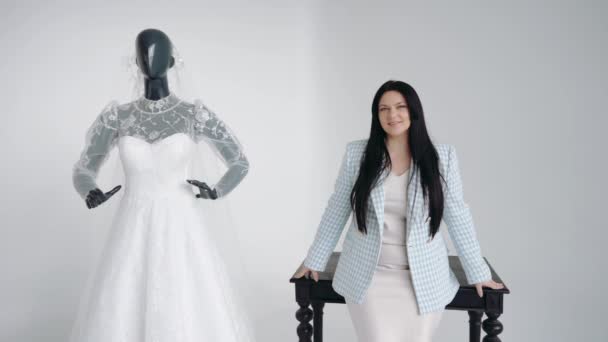 A female designer presents a collection of wedding dresses - Footage, Video
