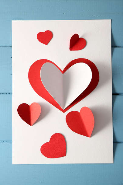 Post card with paper hearts - Zdjęcie, obraz