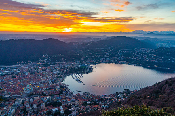 The city of Como, the lakefront and the lake, photographed from Brunate, at dusk, and all the mountains in the background. - Photo, Image