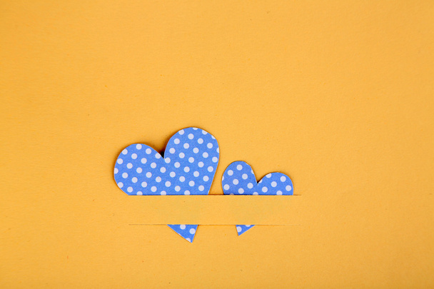 Paper hearts on beige background, close up - Fotó, kép