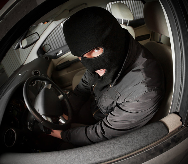 Robber and the thief in a mask hijacks the car - Foto, Bild