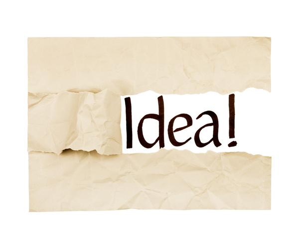 The word "idea" written under a sheet of paper - Φωτογραφία, εικόνα
