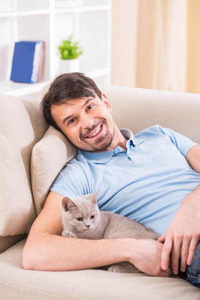 Man with cat - Photo, image