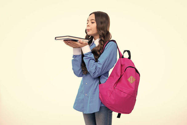 Back to school. Teenager school girl hold book and copybook ready to learn. School children with school bag on isolated white studio background - Photo, Image