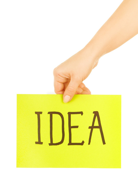 Hand holding a paper with the word "idea" - Foto, imagen
