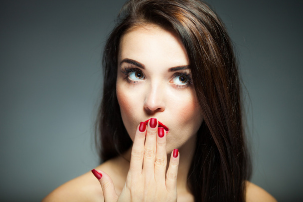 Natural woman face with red nails and lips - Valokuva, kuva