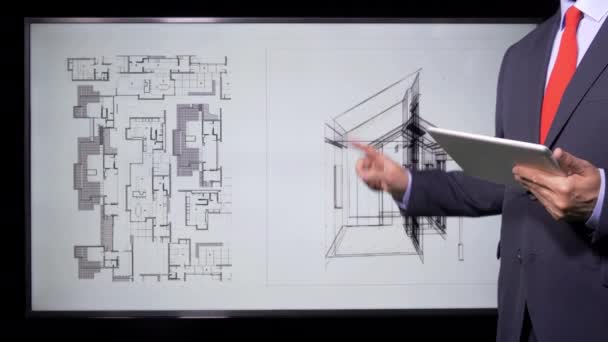 Architect Working on drawings and blueprints on monitor - Materiał filmowy, wideo