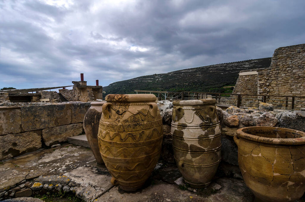 Minoan Pithoi (Pithoi is the Greek name of the large storage containers) at the archaeological site of Knossos in Heraklion city - Photo, Image