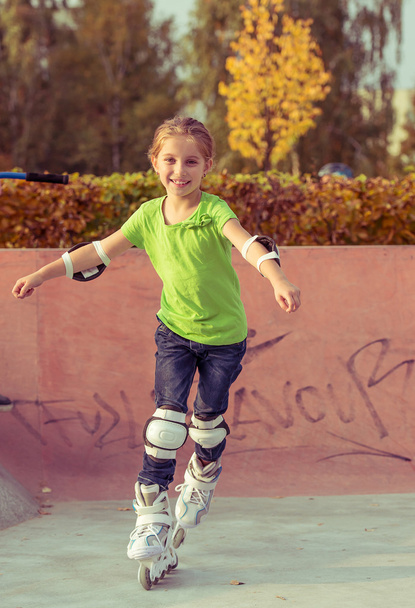 Little girl on roller skates - Photo, image