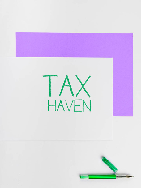 Text caption presenting Tax Haven, Business approach country or independent area where taxes are levied at low rate - Photo, Image