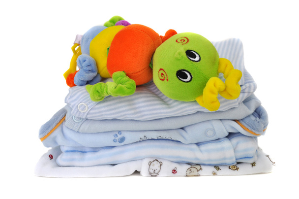 Brinquedo colorido em roupas de bebê
 - Foto, Imagem