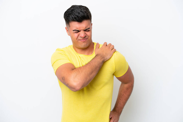 Young caucasian handsome man isolated on white background suffering from pain in shoulder for having made an effort - Foto, immagini