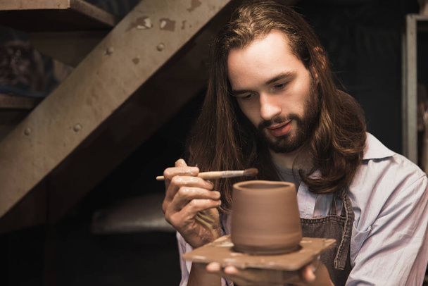 pottery man master work painting clay cup. handcraft pot artist maker with care. - Foto, Imagem
