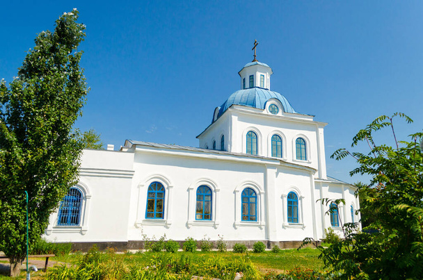 Old white church with a blue roof - Zdjęcie, obraz