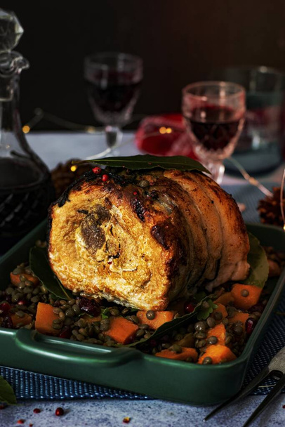 Christmas dinner with roasted ham and lentils - 写真・画像