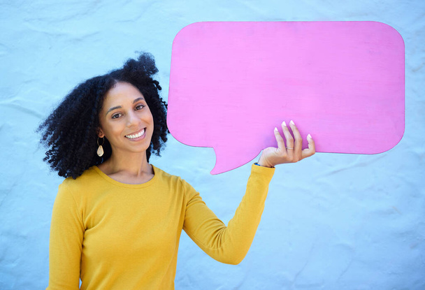Speech bubble, black woman and portrait in studio for advertising, mockup and space on blue background. Face, girl and billboard, branding and paper for product placement, marketing and copy space. - Foto, Imagen