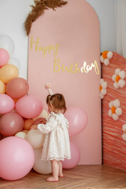 First birthday baby girl. Pink decor. Beautiful dress. - Foto, Imagen