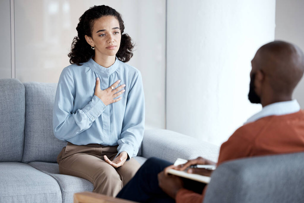 Conversation, sad and woman with a psychologist for therapy, trauma and mental health support. Consultation, psychology and patient talking to a black man during counseling about a life problem. - Foto, afbeelding