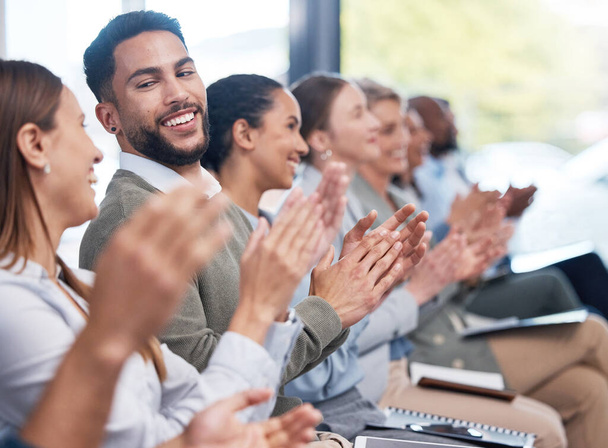 Diverse group of smiling businesspeople clapping in office training. Team of professional colleagues cheering and celebrating together while learning in workshop. Attending a seminar for marketing. - Foto, Bild