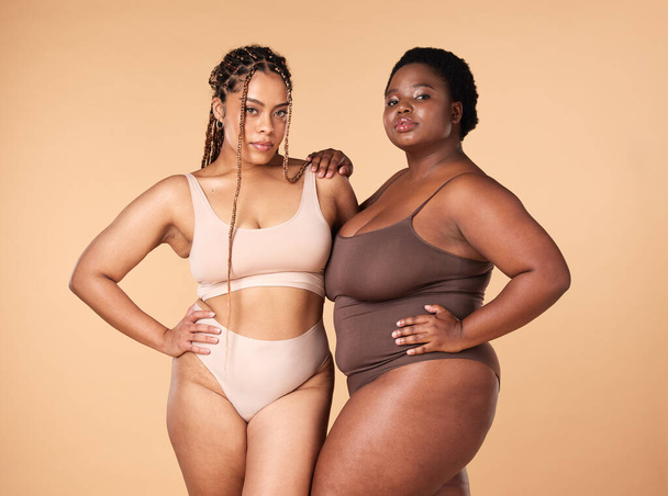 Portrait, beauty and black women with body positivity, skincare and self love isolated in a studio brown background. Shape, plus size and female models confident in underwear as wellness. - Foto, Bild