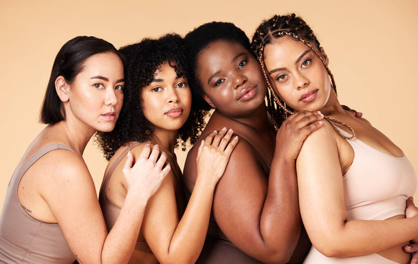 Skin care, diversity and portrait of women group together for inclusion, natural beauty and power. Body positive friends or real people on beige background for support, makeup and plus size self love. - Foto, Imagem