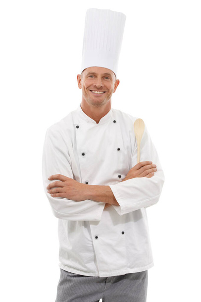 Portrait of chef, wooden spoon and confident smile, cafe owner isolated on white background. Happy executive cook, uniform, cooking for restaurant discount deal, menu special or promotion in studio - Foto, Imagen
