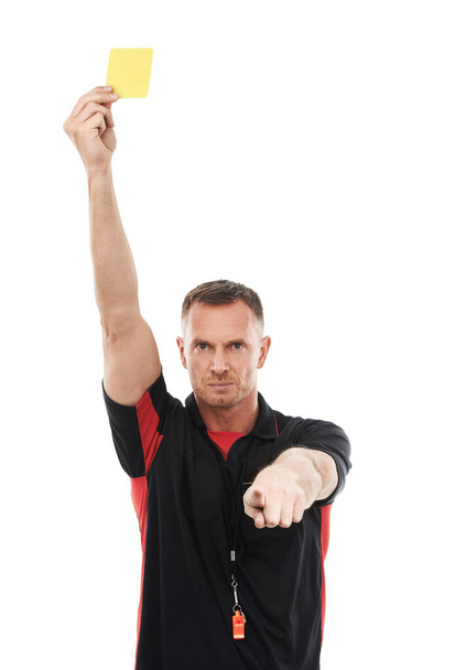 Portrait, foul and yellow card with a soccer referee in studio isolated on a white background for rules. Football, call and warning with a male ref giving a booking during a competitive sports match. - Foto, Imagem