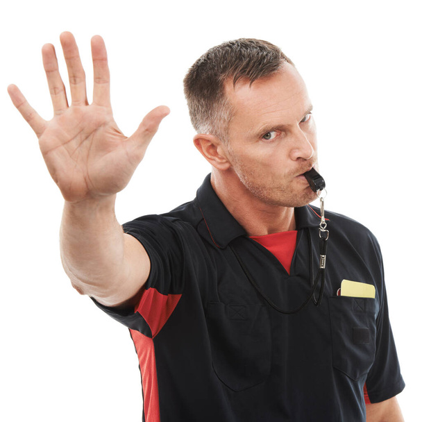 Hand, stop and portrait of man referee blowing whistle for studio warning, penalty or gesture on white background. Sports, coach and palm sign for wrong, pause or emoji, rules or compliance caution. - Photo, Image