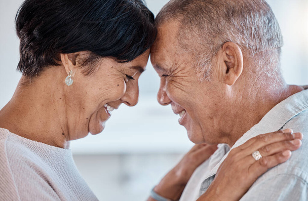 Senior couple, face and a hug for love with a happy smile, commitment and trust together in home. Old man and woman in healthy marriage with care, support and security for retirement lifestyle. - Foto, imagen