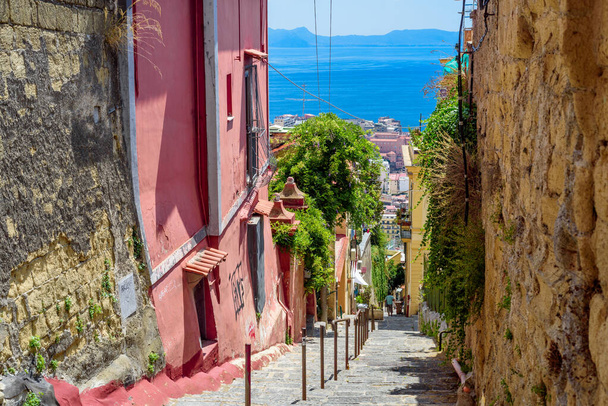 Naples, Italy. View of a glimpse of the Gulf of Naples through the characteristic houses of the Petraio Steps. August 24, 2022. - Fotó, kép