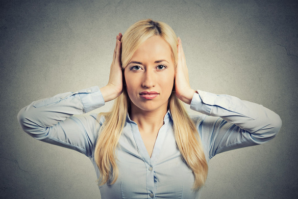 woman covering her ears avoiding unpleasant rude situation - Photo, Image