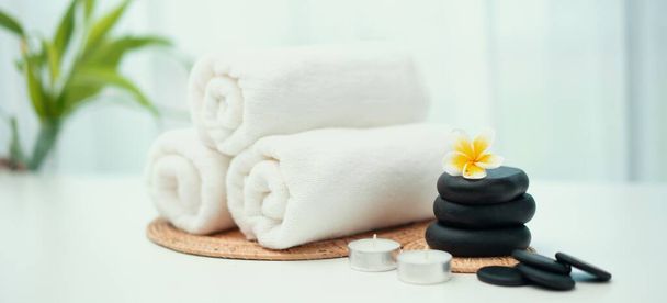 Spa accessory composition set in day spa hotel , beauty wellness center . Spa product are placed in luxury spa resort room , ready for massage therapy from professional service . - Valokuva, kuva